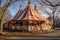 faded, peeling circus tent in disrepair