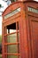Faded and rusty British telephone booth