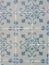 Faded vintage tiles with floral ornate in authentic Portuguese tradition in Lisbon, Portugal