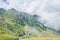 Fagaras mountains, Carpathians with green grass and rocks, cloud