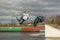 Fagersta, Sweden - Maj 01, 2020: Two teenagers wakeboarders on a lake during a physical education lesson. makes an extreme jump on