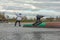 Fagersta, Sweden - Maj 01, 2020: Two teenagers wakeboarders on a lake during a physical education lesson. makes an extreme jump on