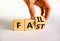 Fail fast symbol. Businessman turns the wooden cube with concept words Fail fast on beautiful white table white background, copy