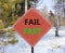 Fail fast symbol. Concept words Fail fast on beautiful red road sign. Beautiful forest snow blue sky background. Business and fail