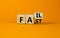 Fail fast symbol. Turned a wooden cube with concept words Fail fast on beautiful orange table orange background, copy space.