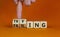 Failing or trying symbol. Businessman turns wooden cubes and changes the word `failing` to `trying`. Beautiful orange backgrou