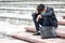 Failure unemployed stressed young Asian business man in suit covering head with hands. A young businessman sitting desperate on