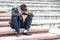 Failure unemployed stressed young asian business man in suit and wearing a face mask covering head with hands. A young businessman