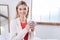 Fair-haired woman posing with a mug of coffee