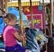 Fair Time: Cowgirl on a Carousel at the Benton Franklin County Fair and Rodeo, Kennewick, Washington