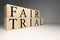 Fair trial word from wooden cubes. About law terms