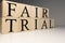 Fair trial word from wooden cubes. About law terms