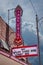Fairfax OK USA - Retro neon Tall Chief Movie sign over marquee reading Why Killers Flower Moon Exhibit Here in town
