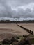 Fairground from the beach, with the tide out