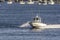 Fairhaven Harbormaster patrol boat skimming across inner harbor