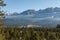 Fairmont Hot Springs, Canada - March 21 2019: panorama view to small town at the foot of a high mountain range