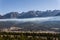 Fairmont Hot Springs, Canada - March 21 2019: panorama view to small town at the foot of a high mountain range