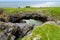 Fairy bridges, impressive stone arches near Tullan Strand, one of Donegal`s surf beaches, County Donegal, Ireland.