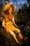 Fairy doll handmade figure sitting on stone in woodland