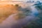 Fairy misty morning over river in countryside. Temperature drop concept