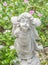 Fairy Statue in the garden with flower