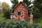 Fairy tale house covered with sweets and Jack and Jill with witch