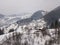 Fairy-tale village Kryvorivnia covered with snow in Carpathians mountains at winter, typical landscape in Hutsulshchyna National