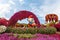 Fairy tale village of Smurfs with big dolls of Smurfs characters in the botanical Dubai Miracle Garden in Dubai city, United Arab