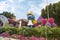 Fairy tale village of Smurfs with big dolls of Smurfs characters in the botanical Dubai Miracle Garden in Dubai city, United Arab