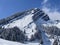 Fairytale alpine winter atmosphere and snow-capped alpine peak Stockberg 1781 m in the Alpstein mountain massif, Nesslau