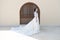 Fairytale dress. Things consider for wedding abroad. Bride adorable white wedding dress sunny day architecture