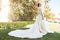 Fairytale dress. Things consider for wedding abroad. Bride adorable white wedding dress sunny day palm tree background