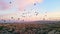 fairytale scenery - hot air balloons flying over the valley in Cappadocia at sunrise, magic shot