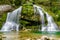 Fairytale Virje waterfall in Slovenia - Pluzna. Dreamy and beautiful natural double waterfall shot on long exposure.