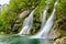 Fairytale Virje waterfall in Slovenia - Pluzna. Dreamy and beautiful natural double waterfall shot on long exposure.