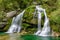 Fairytale Virje waterfall in Slovenia - Pluzna. Dreamy and beautiful natural double waterfall shot on long exposure.