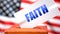 Faith and American elections, symbolized as ballot box with American flag in the background and a phrase Faith on a ballot to show