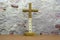 Faith letters holy cross on leather table and concrete wall background