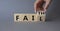 Faith vs Fail symbol. Businessman hand Turnes cube and changes word Fail to Faith. Beautiful grey background. Business and Faith