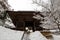 Faithful man walking along stair with covered by snow through the Nio-mon Gate of Yamadera