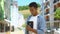 Faithful mixed-race teen male looking at holy bible in hands, religion and God