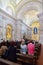 Faithful praying in the interior of the Sanctuary of Sao Bento da Porta Aberta