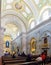 Faithful praying in the interior of the Sanctuary of Sao Bento da Porta Aberta.