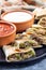 Fajita quesadilla with pieces of beef steak, green bell pepper, onion and cheese, on plate, closeup