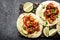 Fajitas in tortillas with fried shrimps, bell peppers and onion