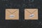 Fake emails or online scams, email envelop icons with real vs fake labels on them