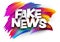 Fake news paper word sign with colorful spectrum paint brush strokes over white