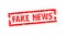 Fake news rubber stamp cell phone