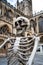 A fake skeleton posed outside of Bath Cathedral