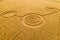 Fake UFO circles on grain crop yellow field, aerial view from drone. Round geometry shape symbols as alien signs